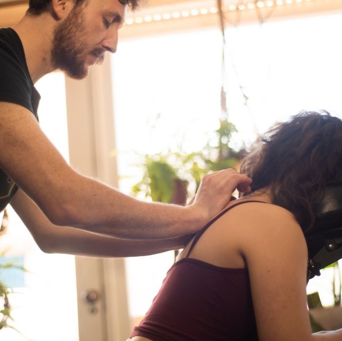 Alex massaging a ladies back