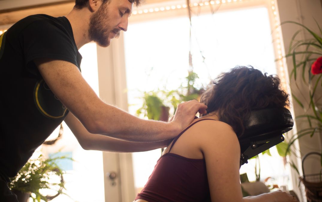 Alex massaging a ladies back